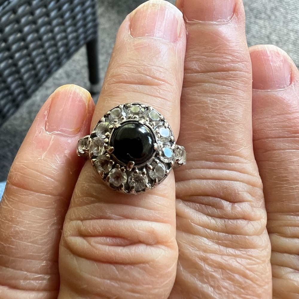 Evermore size 5 sterling silver ring with black onyx surrounded by white topaz.